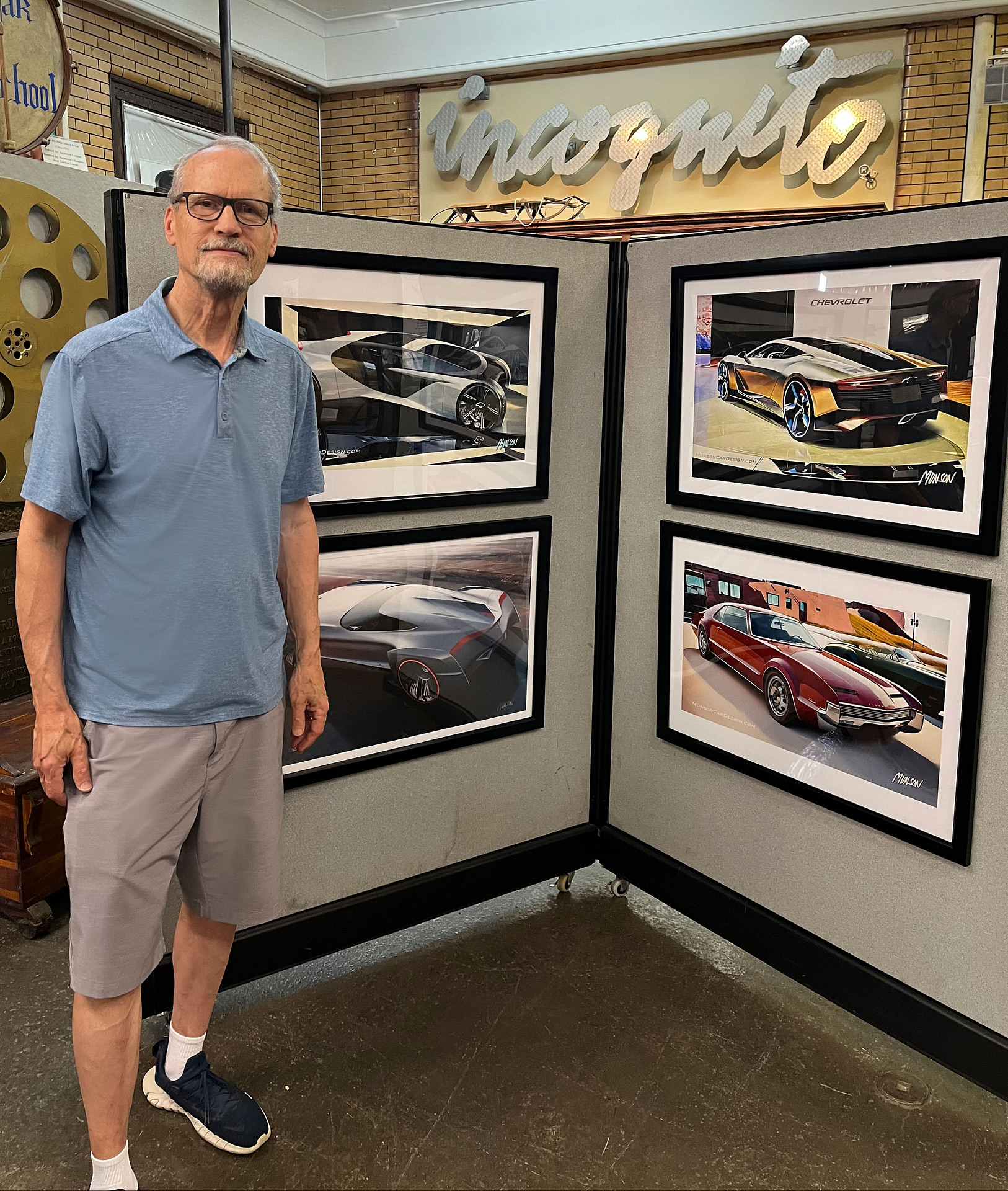 Bob Munson with 4 prints of original artwork